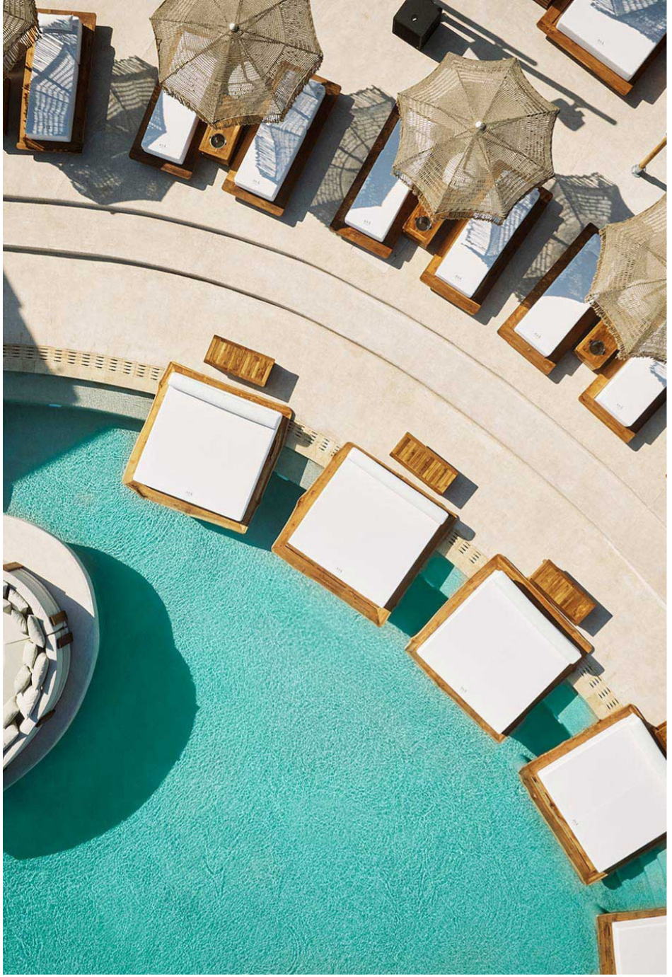 Aerial view of poolside loungers and parasols